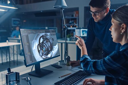 Engineer,Working,On,Desktop,Computer,,Screen,Showing,Cad,Software,With